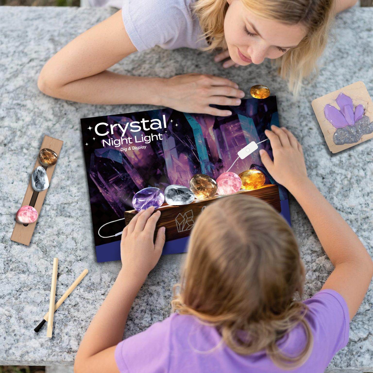Adult and child arranging recovered crystals on the Crystal Night Light base