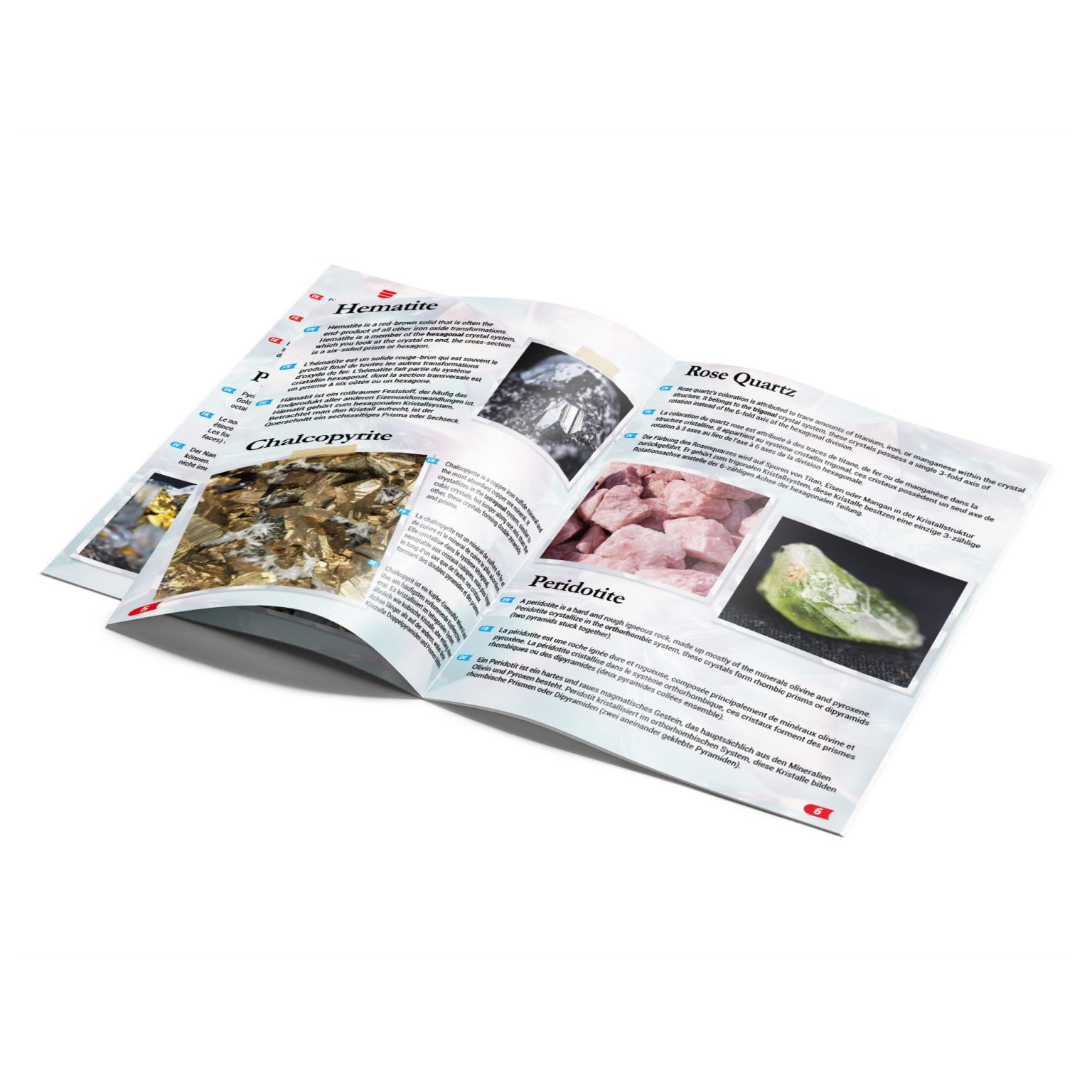Open illustrated mineral guide showing hematite, rose quartz, chalcopyrite, and peridotite