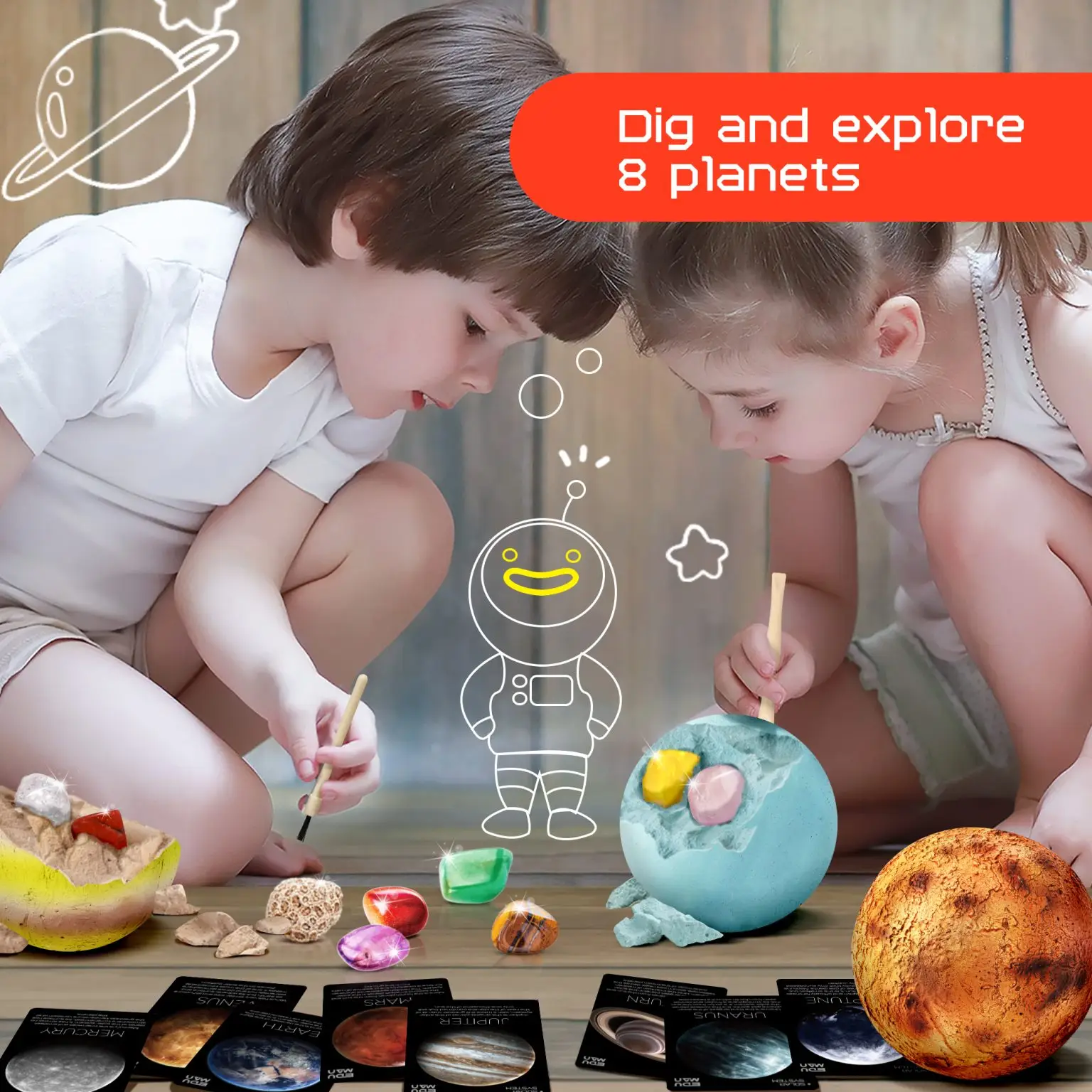 Two children brushing hidden specimens from planet-shaped excavation blocks